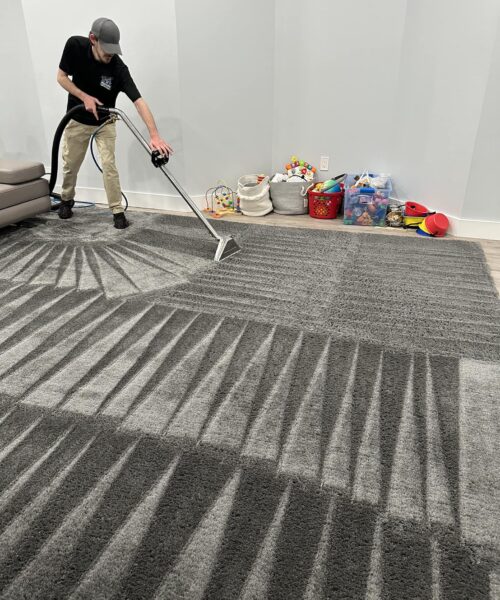 Poseidon Carpet Cleaning team cleaning rug